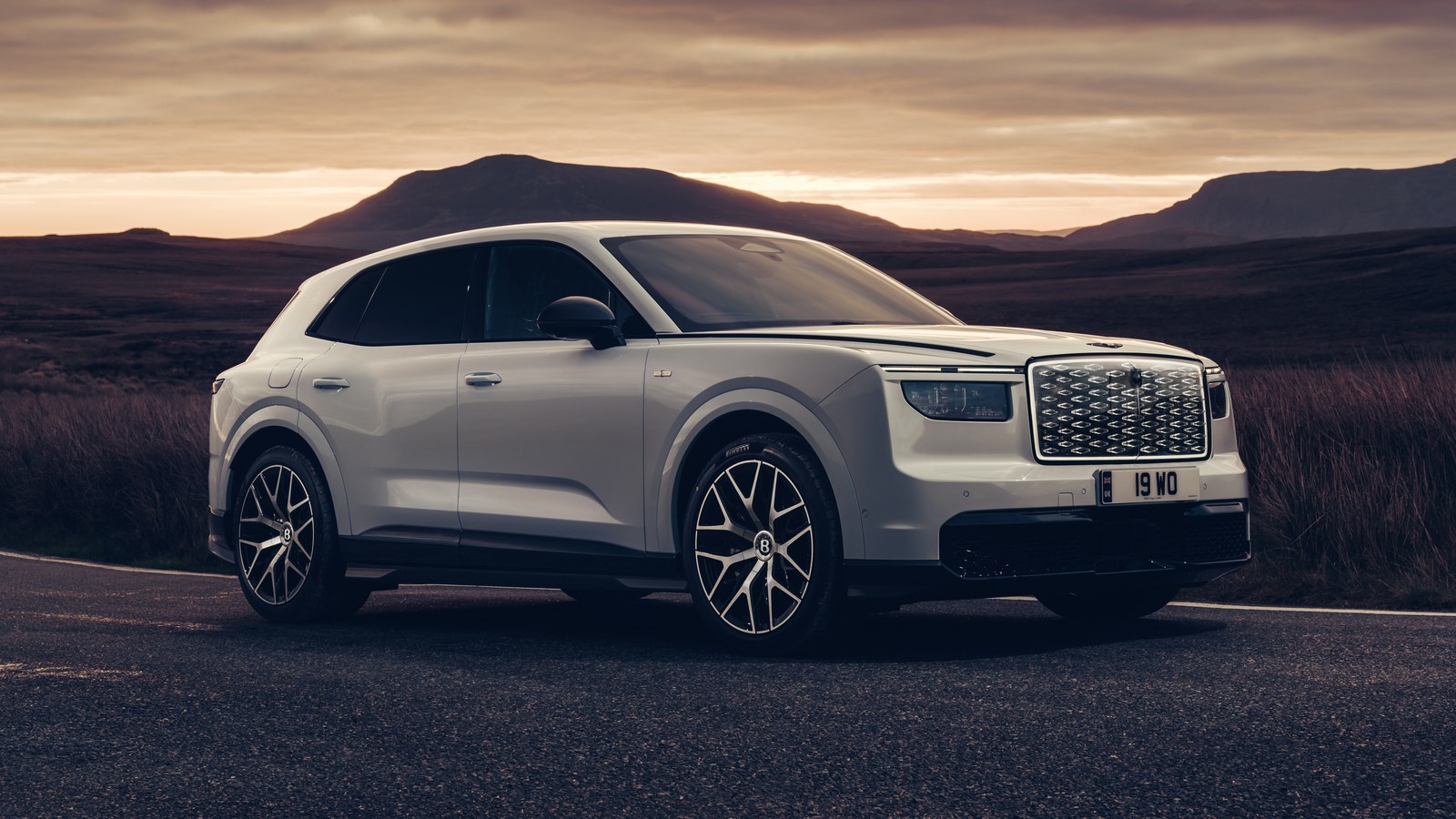 White Bentley Torcal First Edition parked on a moorland road at sunset