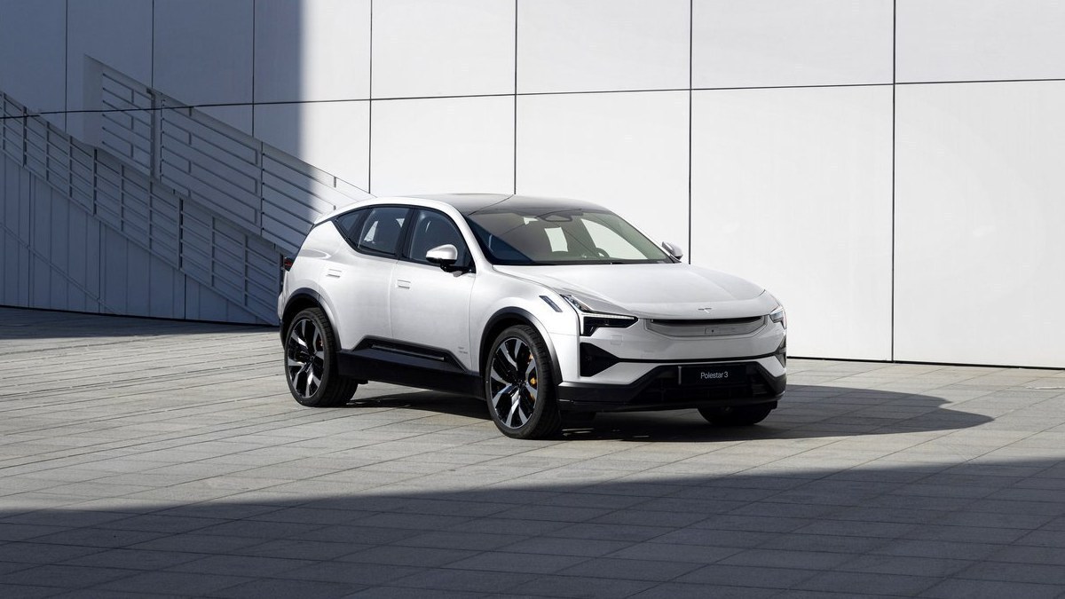 White Polestar 3 SUV parked in front of a white building
