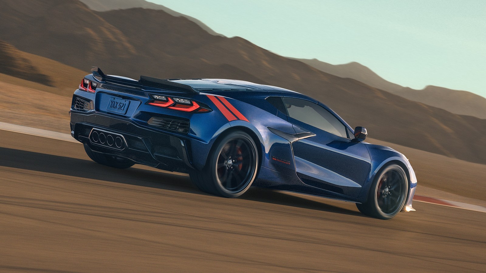 Blue 2027 Chevrolet Corvette Grand Sport cornering on a desert track