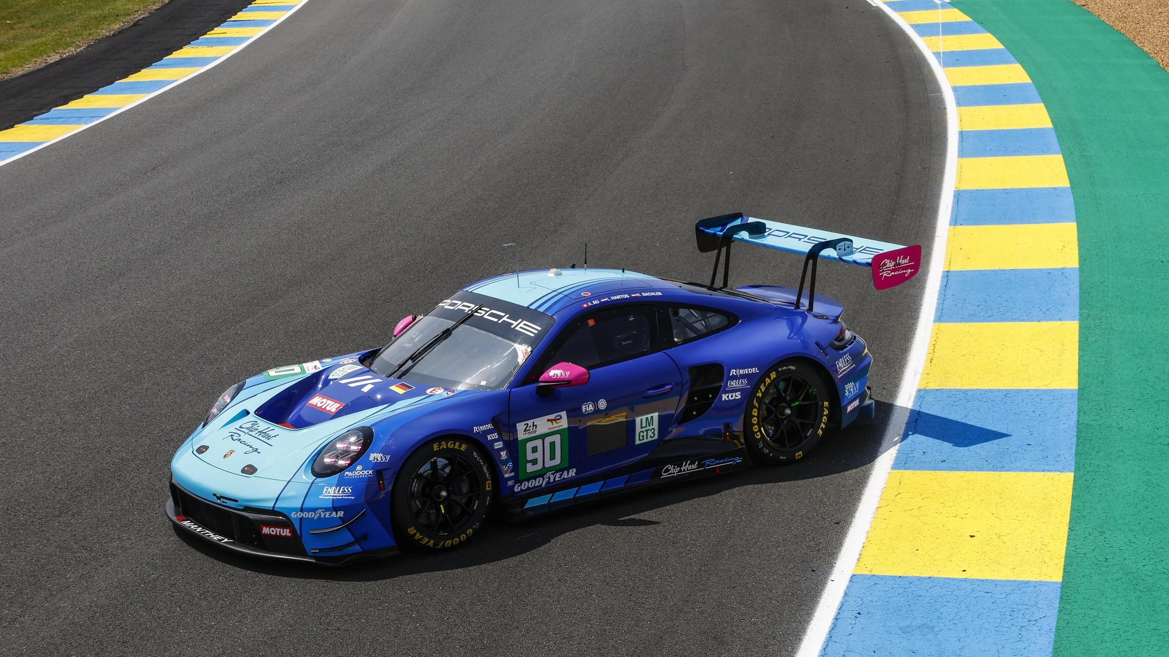 Porsche 911 GT3 R in blue Chip Hart Racing livery at Le Mans