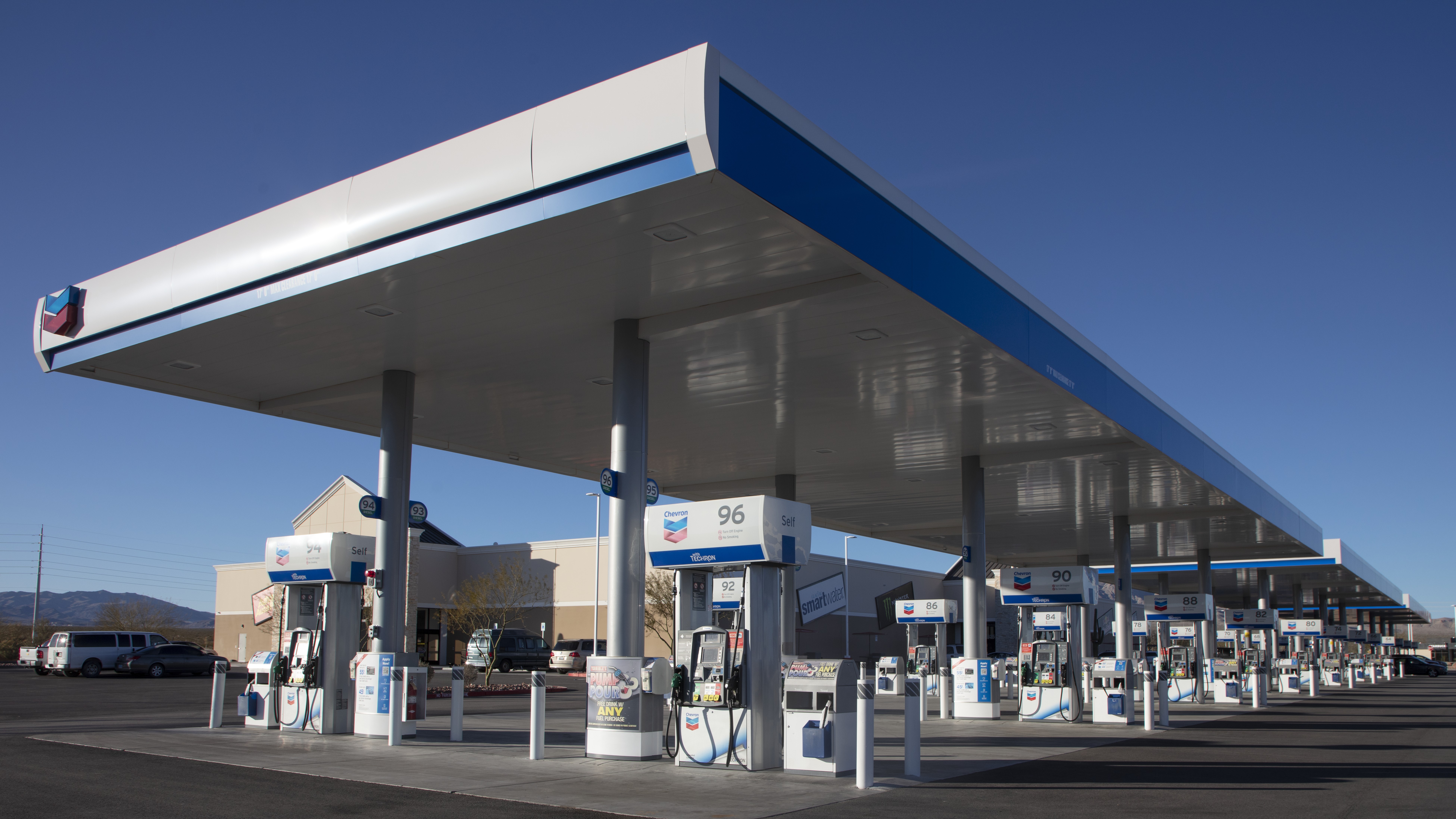 Rows of pumps under the canopy of a large Chevron gas station in Nevada