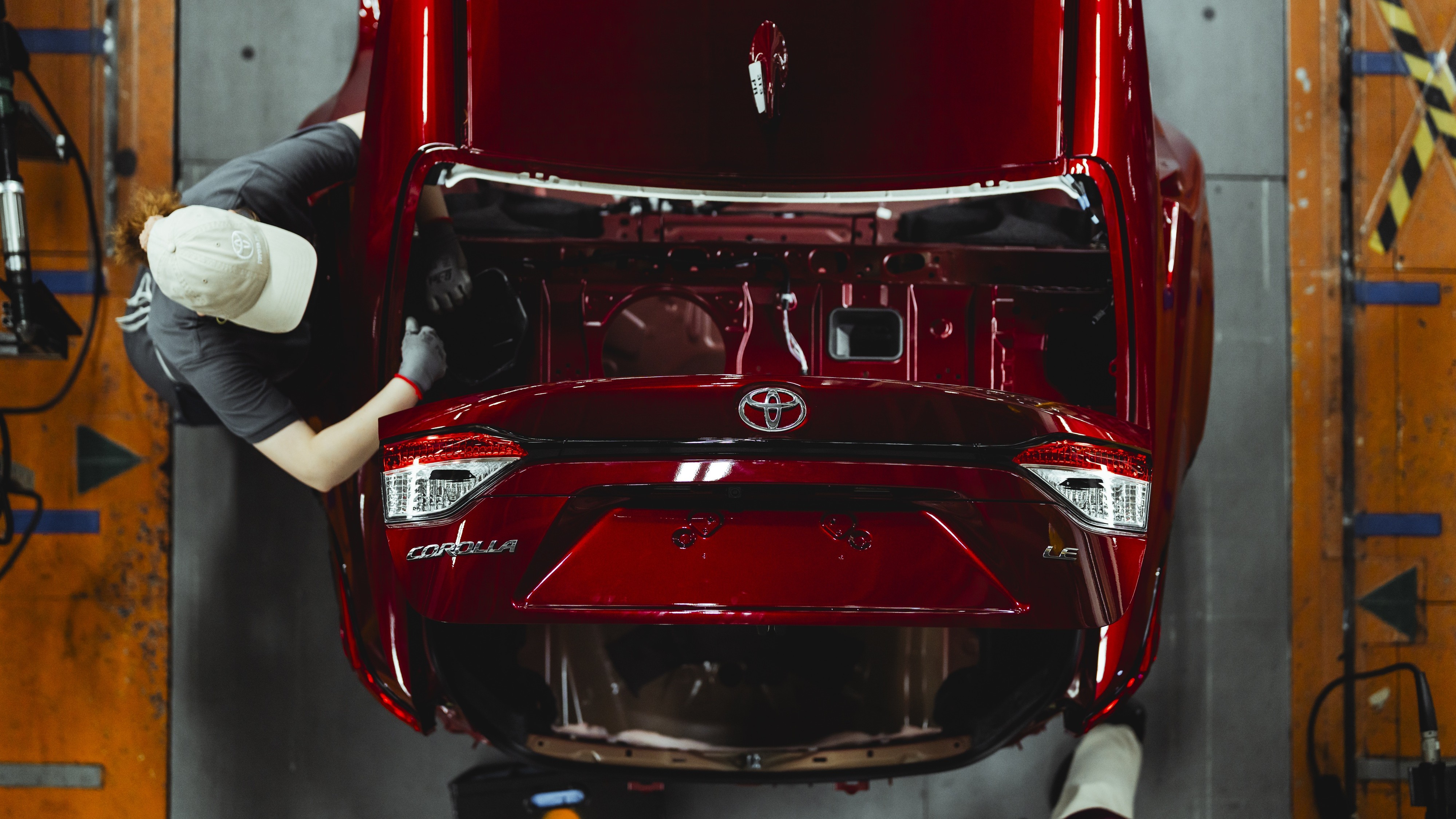 Overhead view of a red Corolla LE on the assembly line at Toyota Mississippi