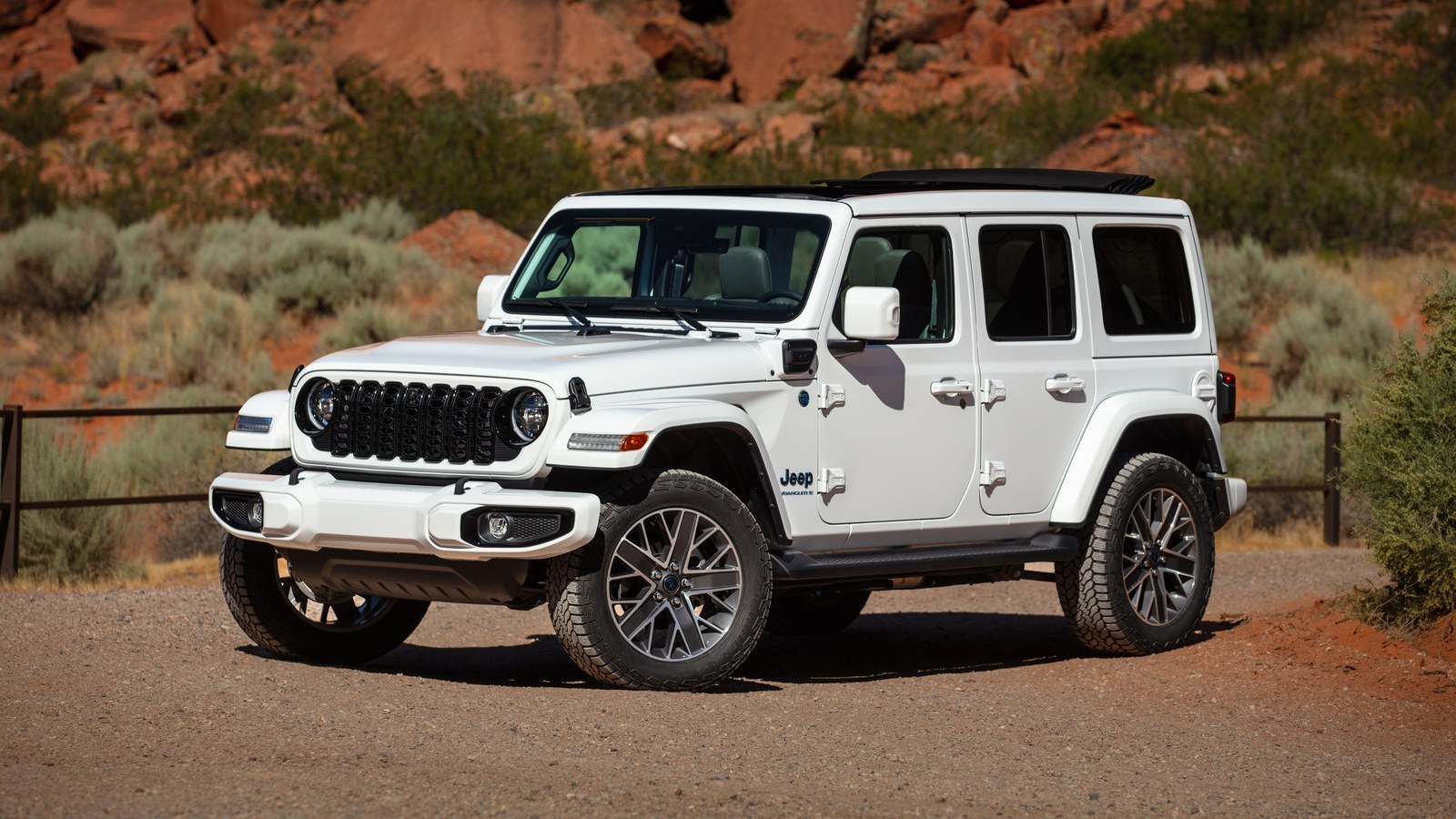 White 2025 Jeep Wrangler High Altitude 4xe parked on a desert trail