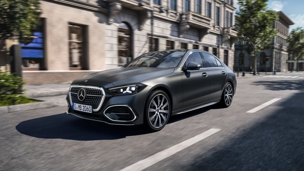 Gray 2027 Mercedes-Benz C-Class sedan driving on a city street