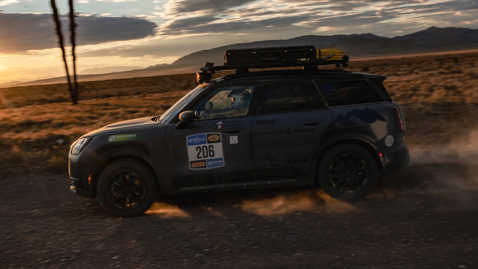 MINI Countryman Untamed Edition No. 206 driving across the desert at sunset