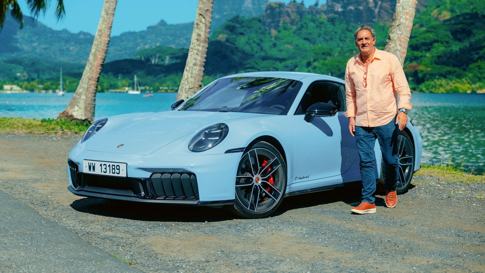 Gulf Blue Porsche 911 Carrera GTS parked by a lagoon on Mooréa