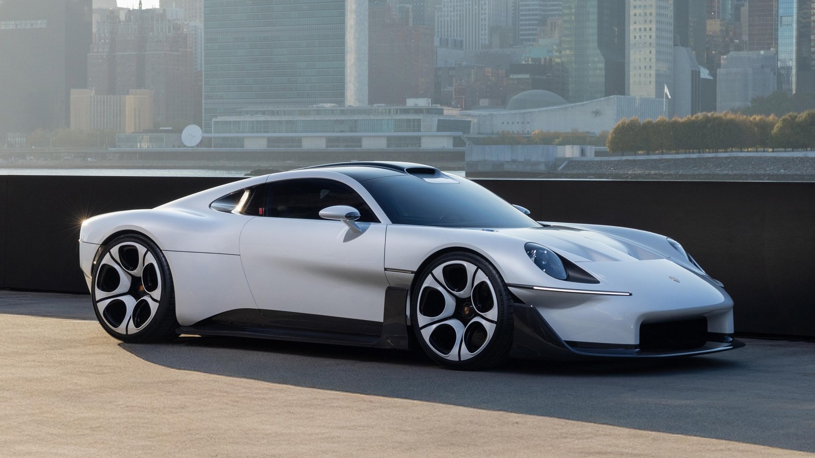 Porsche Mission S vision model on a pier with Manhattan skyline