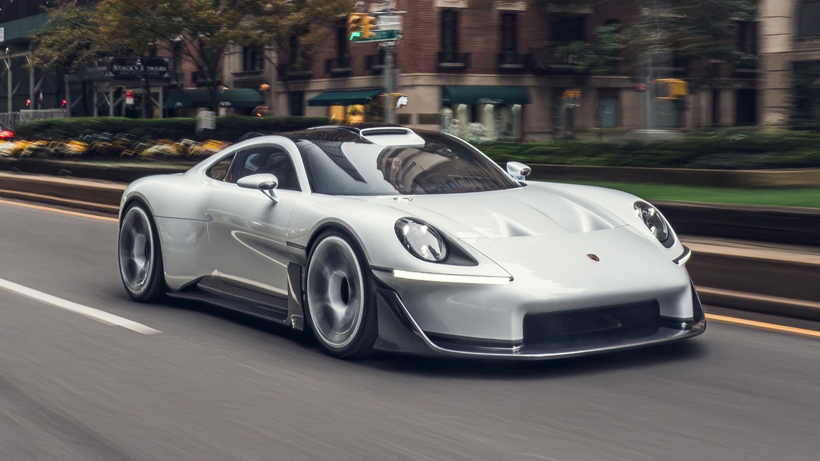 White Porsche Mission S concept driving on a New York avenue