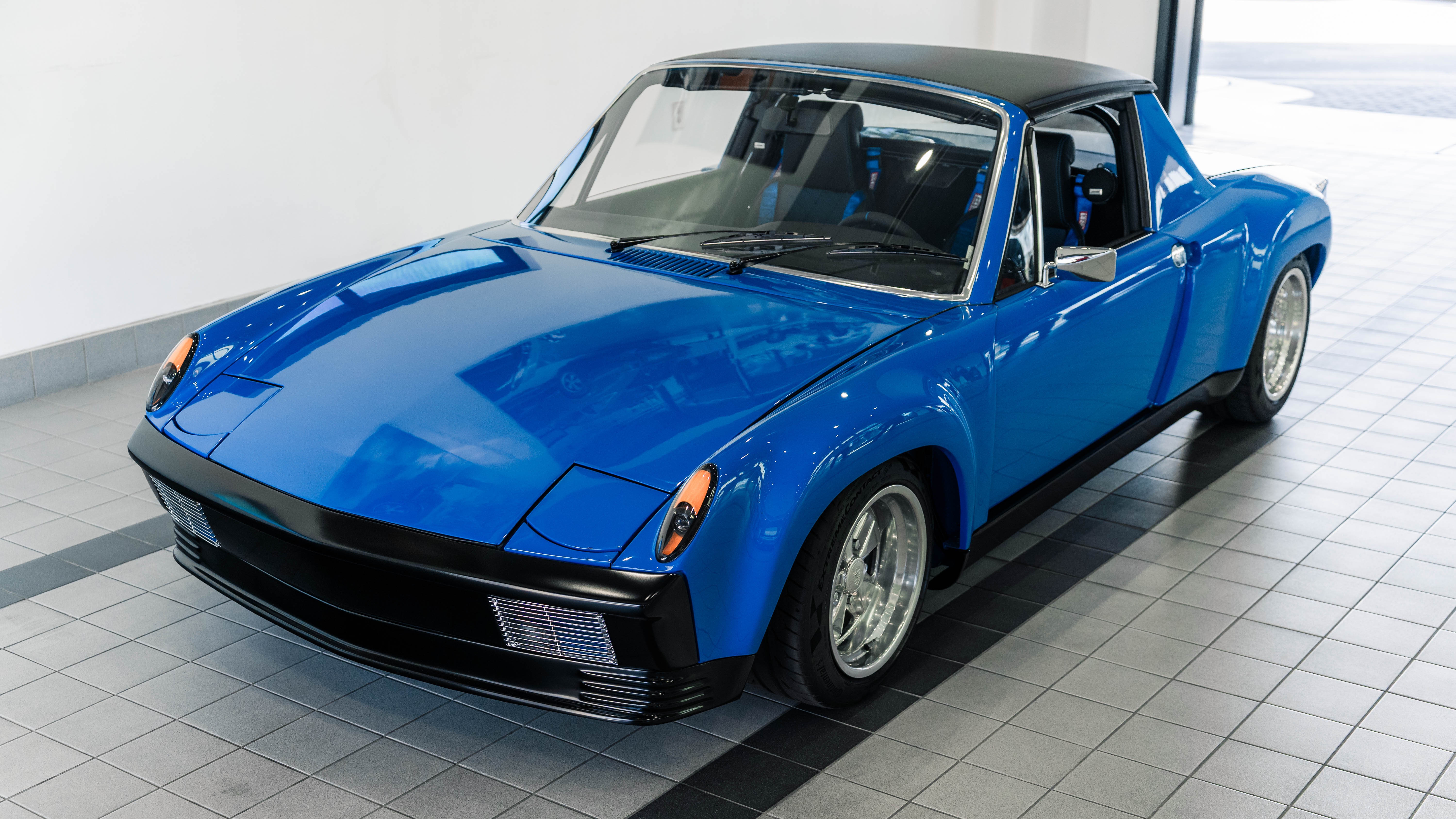 Restored blue 1973 Porsche 914 built by Porsche Tucson, front three-quarter view