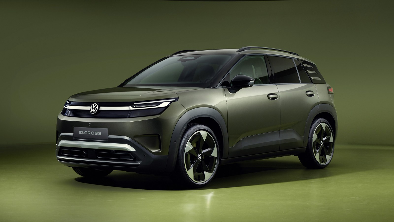 Volkswagen ID. Cross electric SUV front three-quarter view in green studio