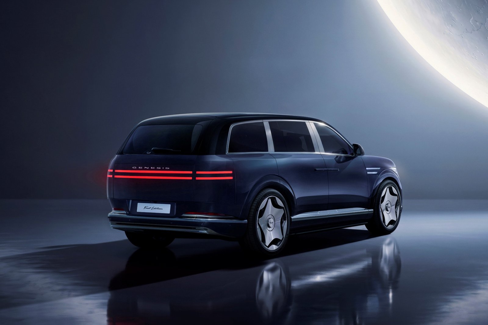 Rear view of the Genesis GV90 with full-width taillights