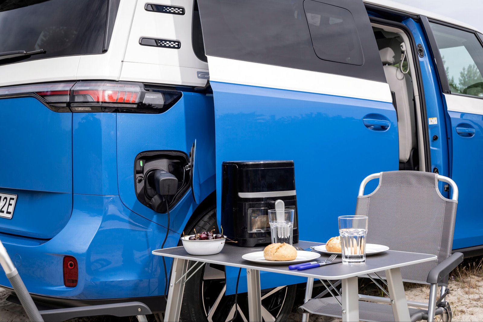 ID. California Cruise PowerSocket adapter powering a countertop oven at a campsite