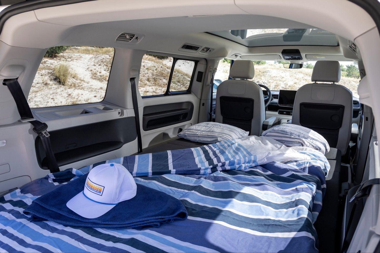 Fold-out bed inside the Volkswagen ID. California Cruise viewed from the tailgate