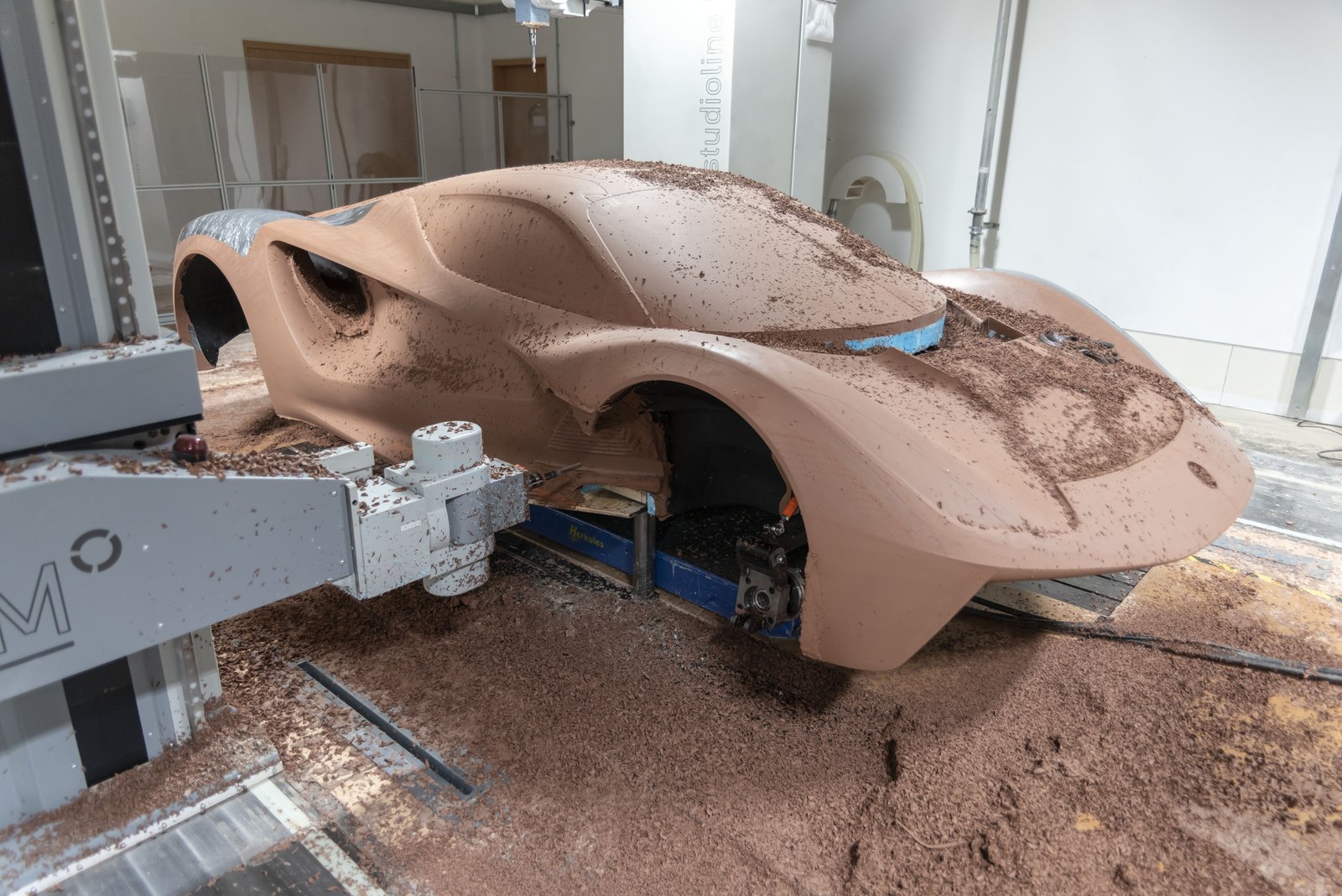 Milling machine shaping a clay model of the Lotus Evija