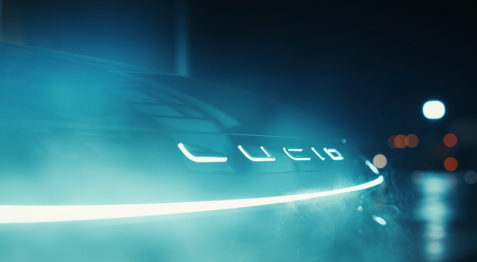 Darkened teaser of a Lucid front end with illuminated logo