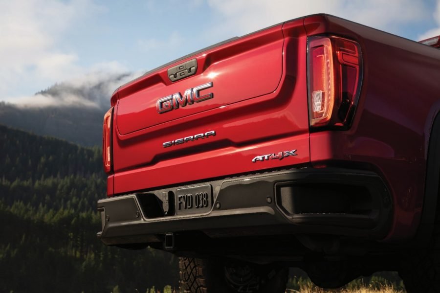 Rear view of a red GMC Sierra AT4X showing its MultiPro tailgate