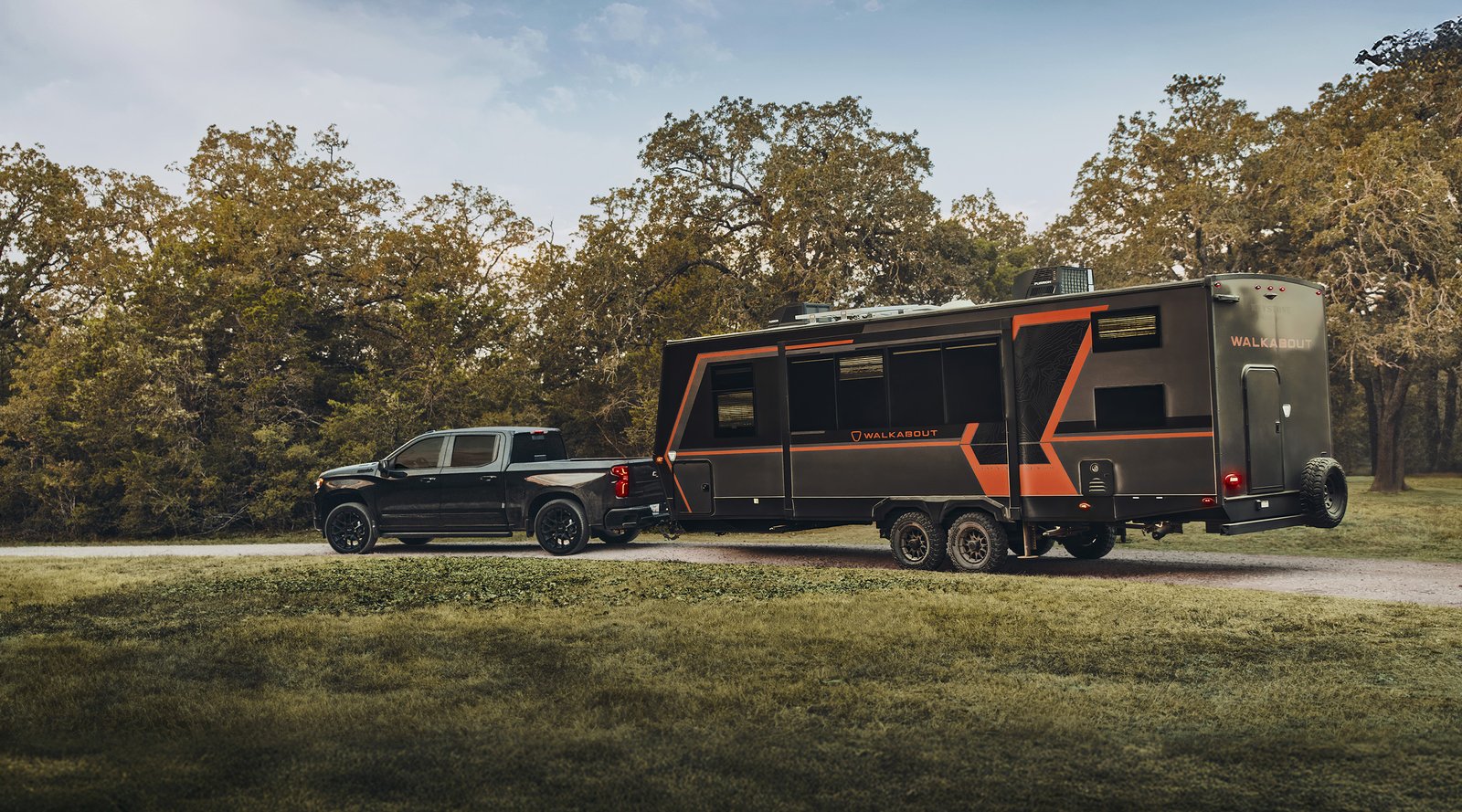 2026 Chevrolet Silverado 1500 High Country towing a travel trailer