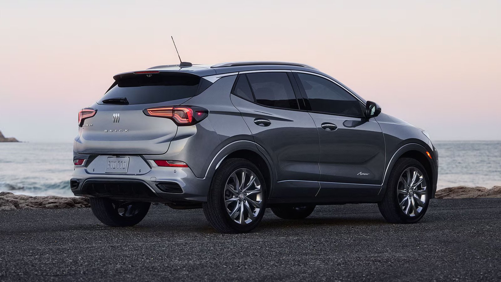Buick Encore GX rear three-quarter view by the ocean