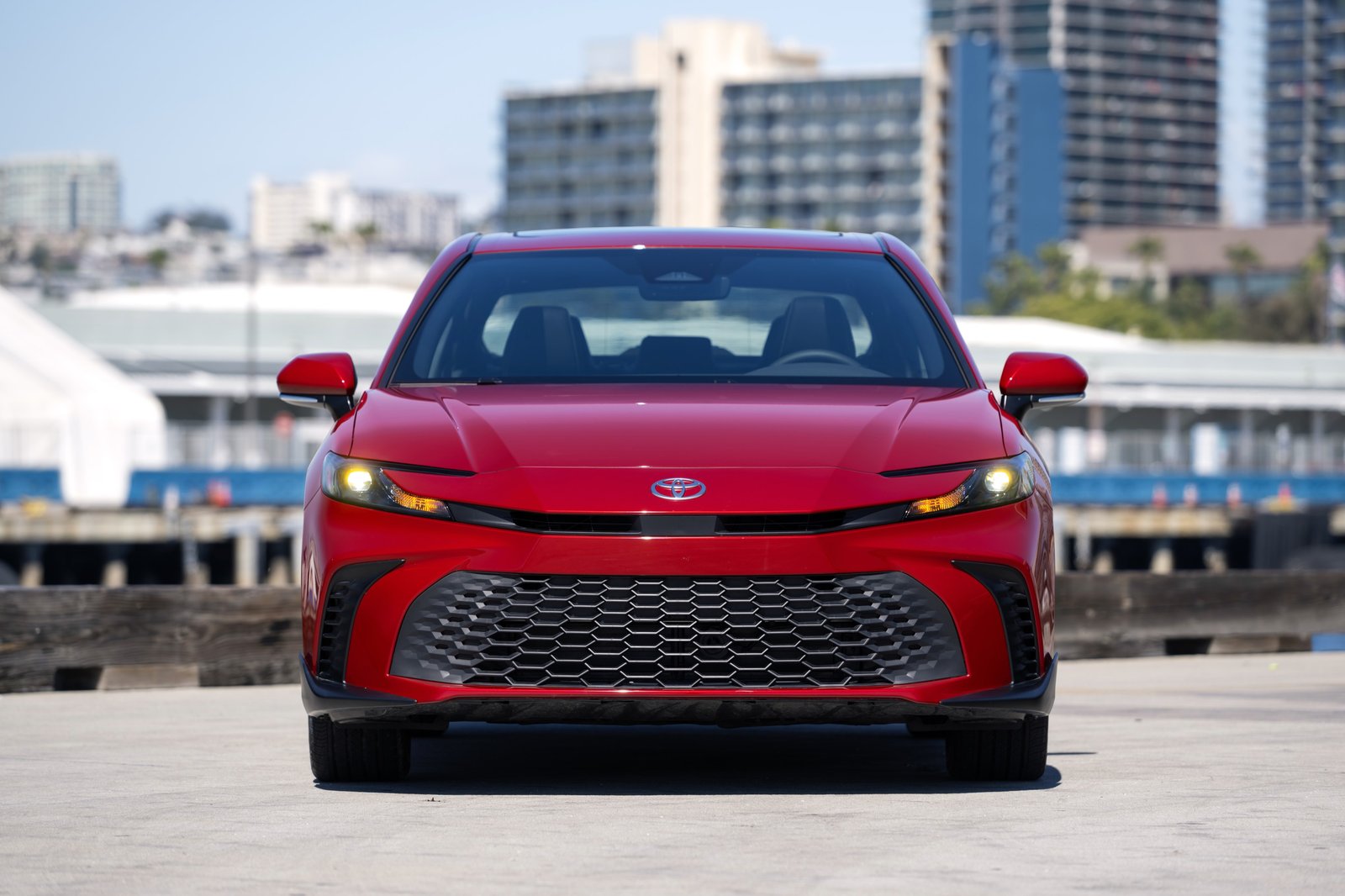 2026 Toyota Camry SE AWD in Supersonic Red, head-on view