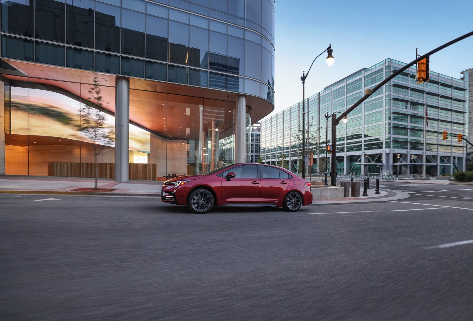 2026 Toyota Corolla Hybrid SE AWD side view on a city street