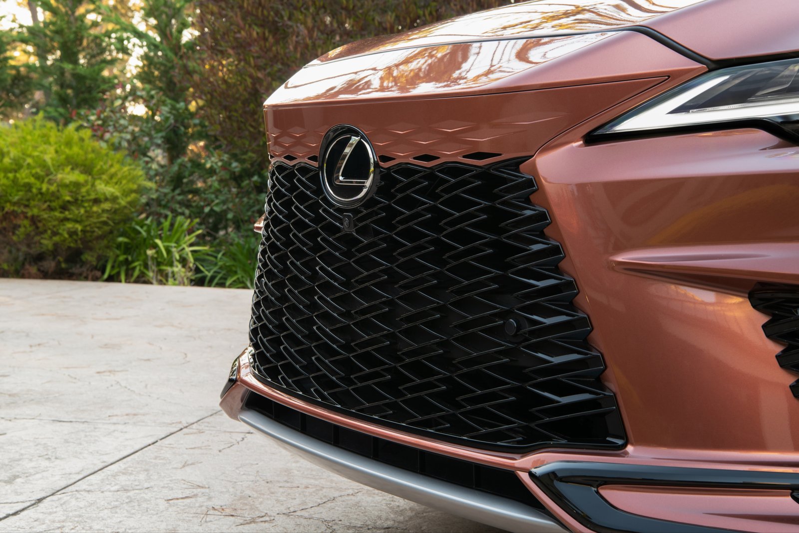 Close-up of the 2026 Lexus RX 500h F Sport Performance grille and lower intake