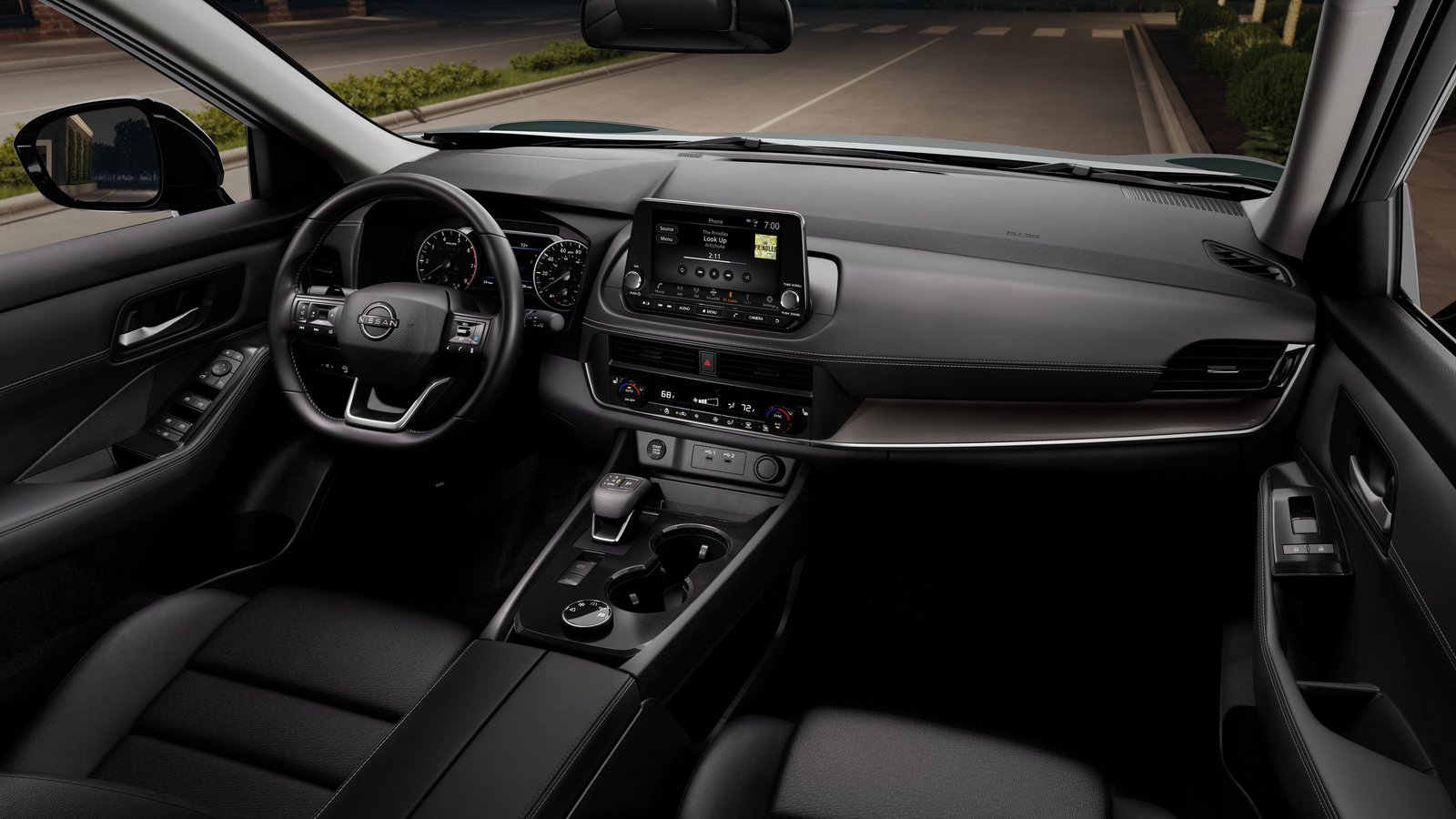2027 Nissan Rogue interior with 8-inch touchscreen and analog gauges