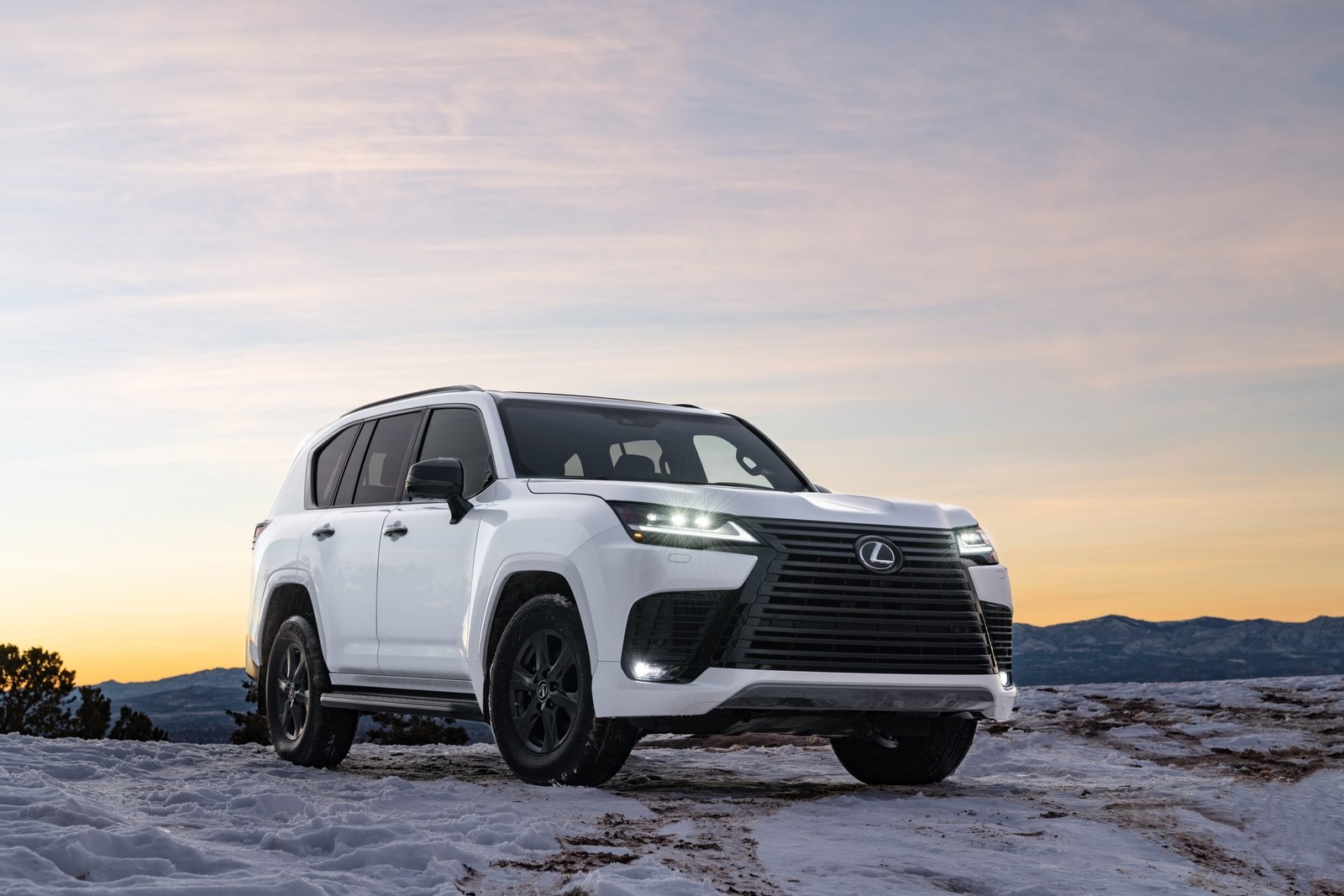 White 2027 Lexus LX 600 Premium with dark 20-inch wheels in snow