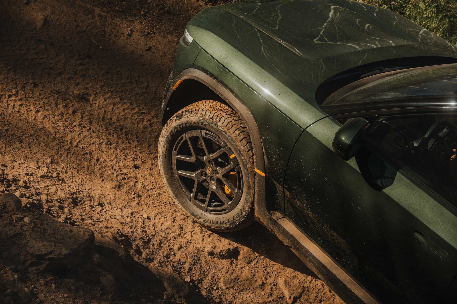 Close-up of Rivian R2 BFGoodrich Trail-Terrain all-terrain tire in mud