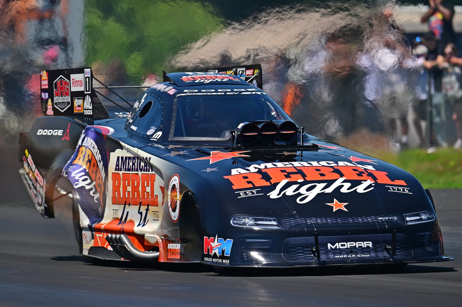 Matt Hagan's Dodge Charger Funny Car on track, three-quarter front view
