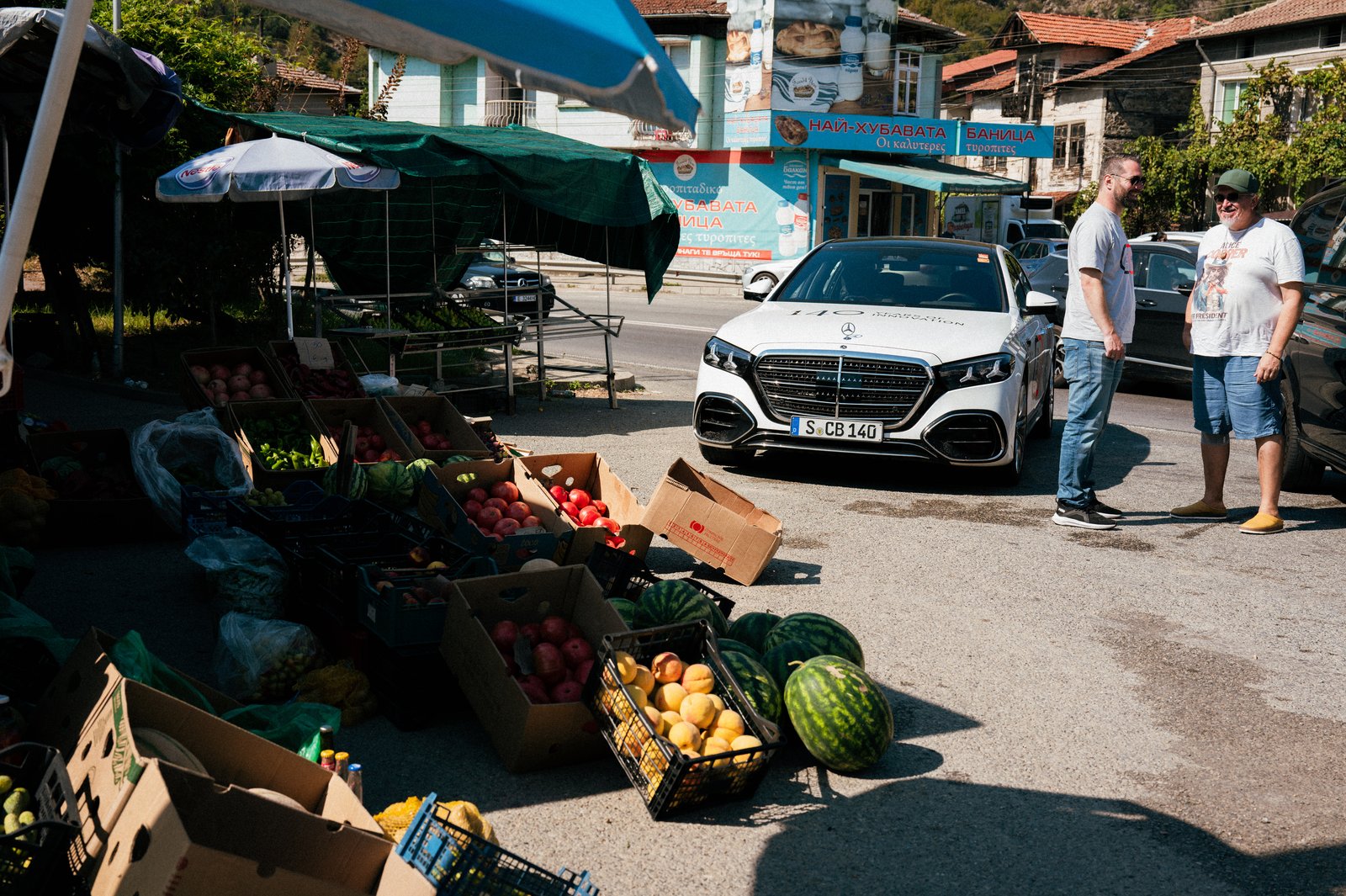 White Mercedes S-Class at a roadside fruit market in Bulgaria