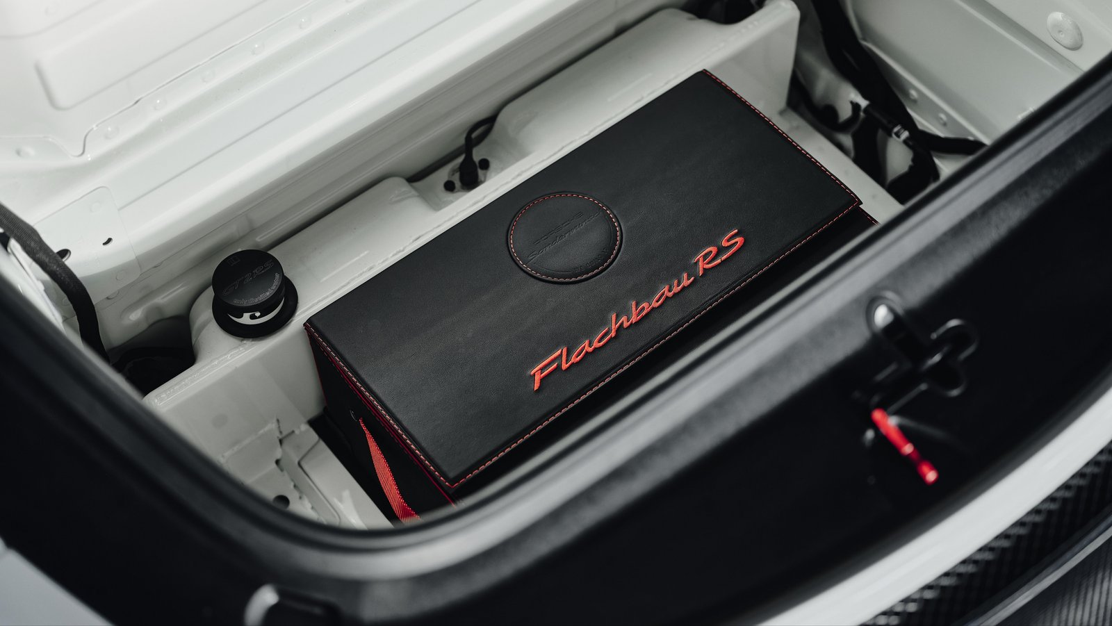 Removable leather box labeled Flachbau RS in the front trunk