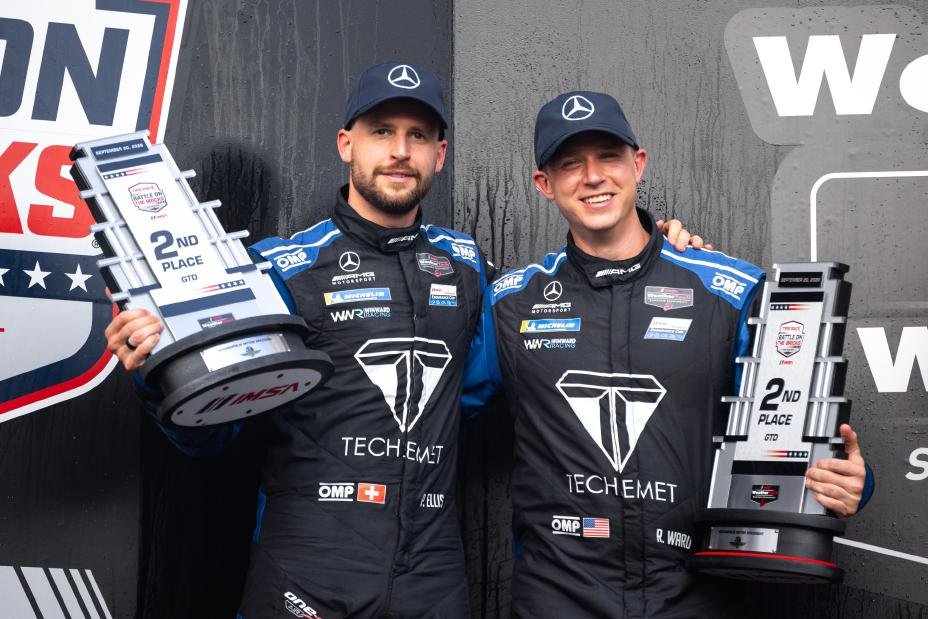 Philip Ellis and Russell Ward hold second-place trophies at Indianapolis