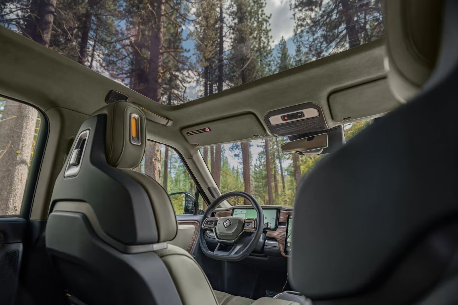 Rivian R1 interior with center touchscreen and panoramic roof