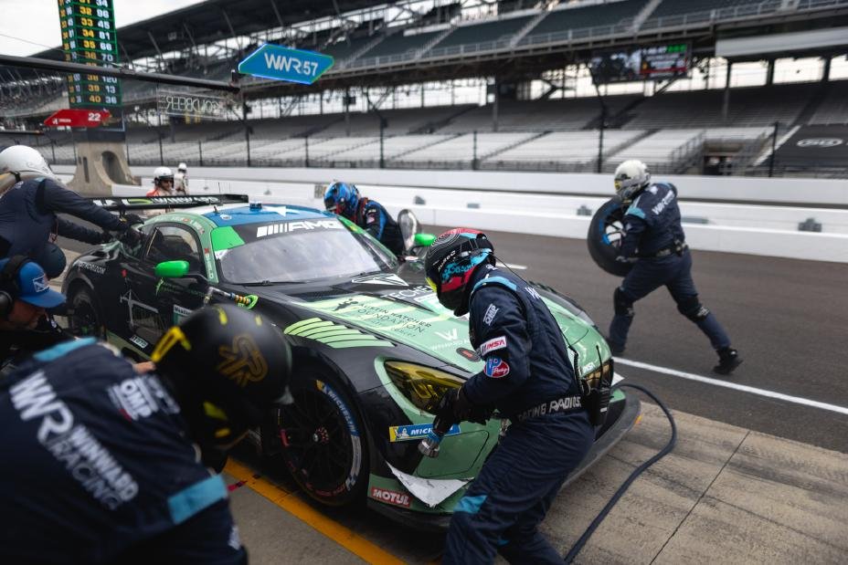 Winward Racing crew services the No. 57 Mercedes-AMG GT3 during a pit stop