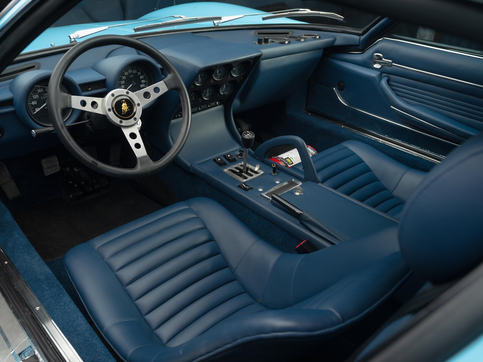 Blue leather interior of Lamborghini Miura SV with manual gearbox