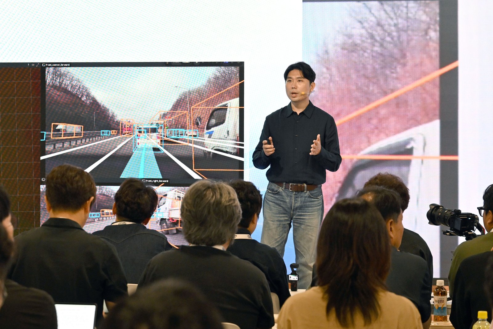 Two Hyundai executives riding in autonomous test vehicle on highway