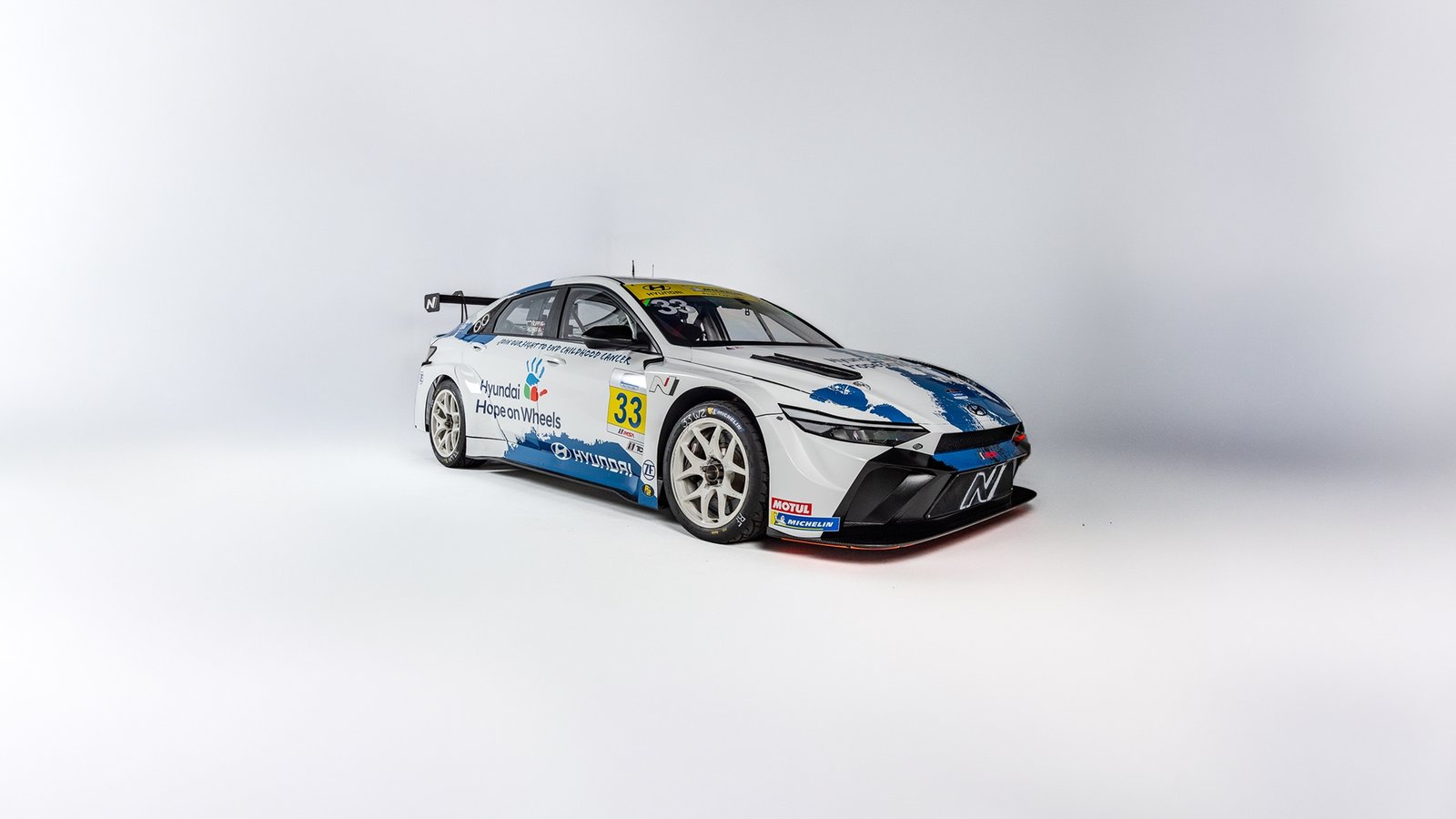 White and blue Hyundai Elantra N TCR race car studio shot