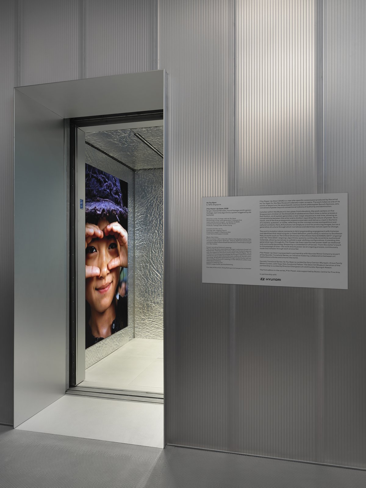 Open New Museum elevator beside wall text crediting Hyundai