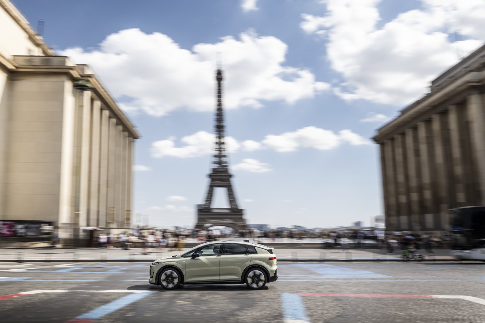 Audi A2 e-tron driving past the Eiffel Tower in Paris