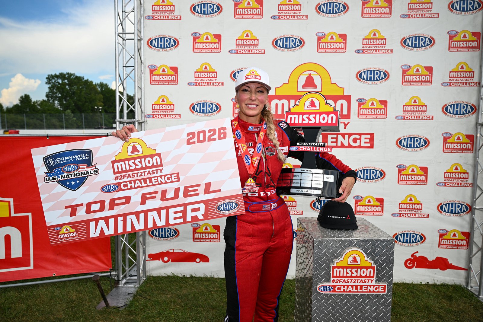 Leah Pruett holding Top Fuel winner trophy at 2026 NHRA U.S. Nationals