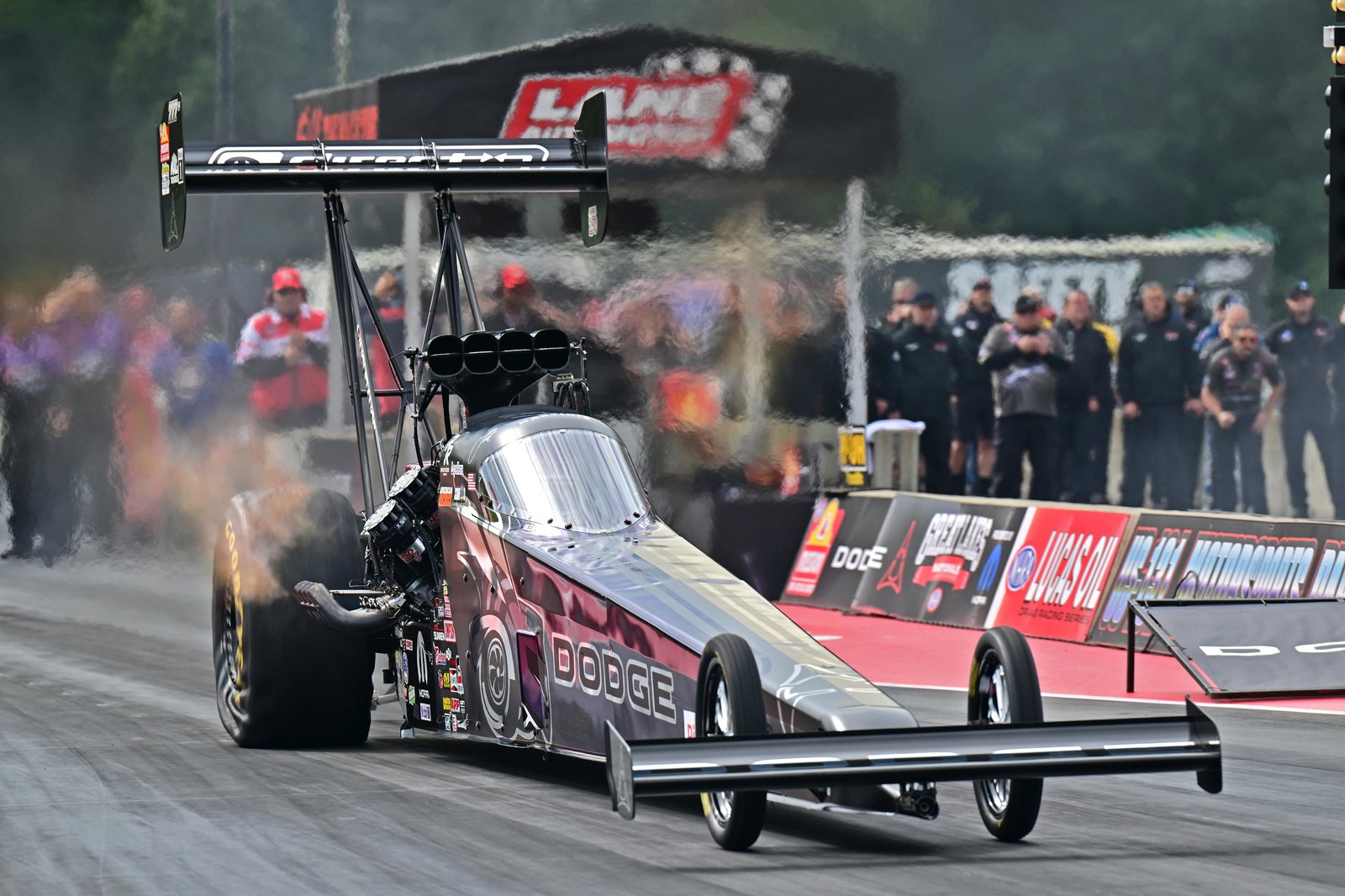 Leah Pruett's Dodge Top Fuel dragster launching at US 131 Motorsports Park