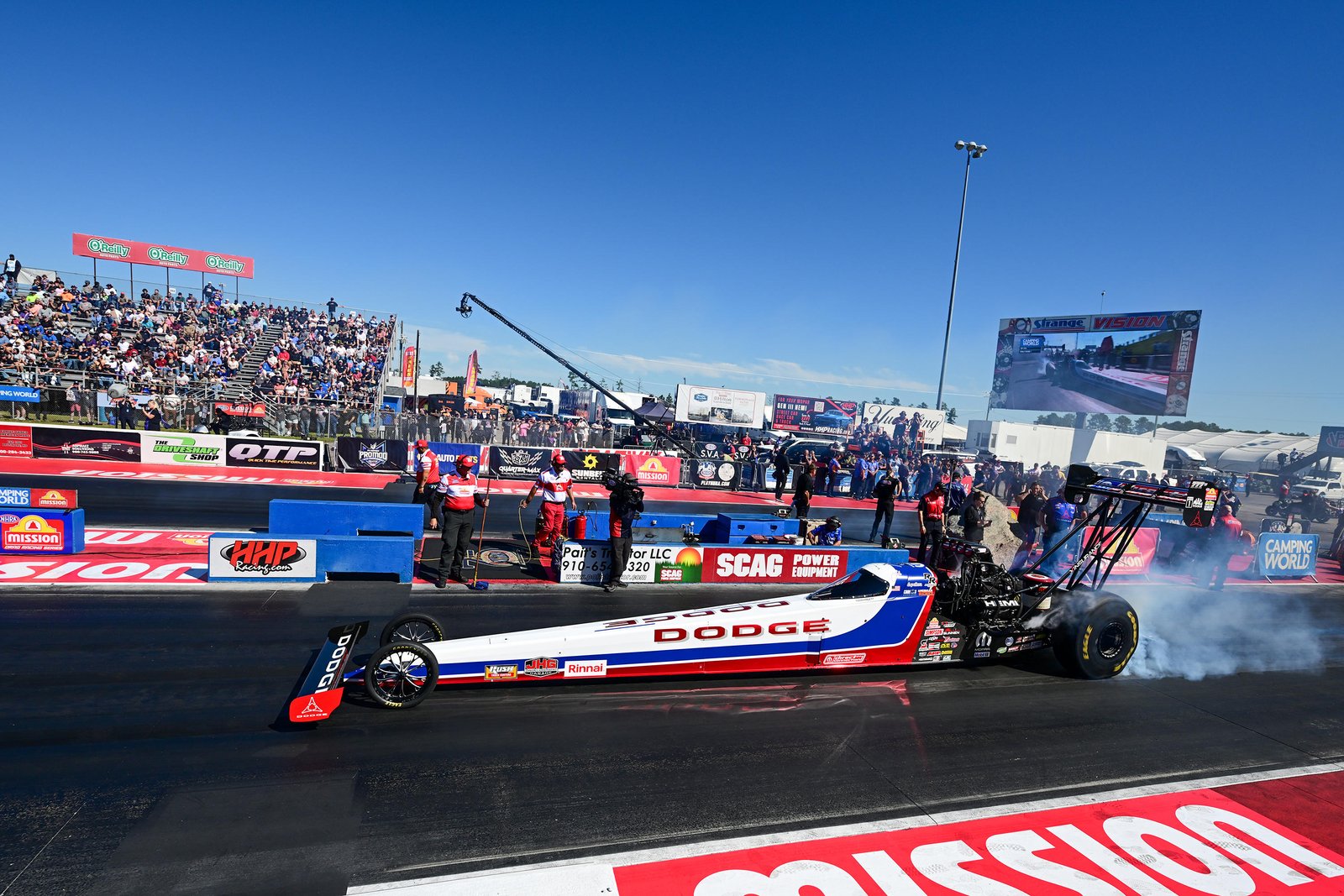 Leah Pruett's Dodge Top Fuel dragster doing a burnout at Rockingham Dragway