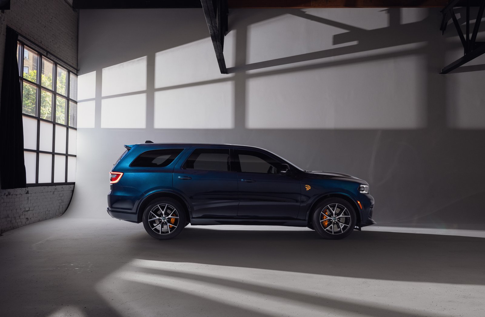 Side profile of 2027 Dodge Durango SRT Hellcat in After Dark blue