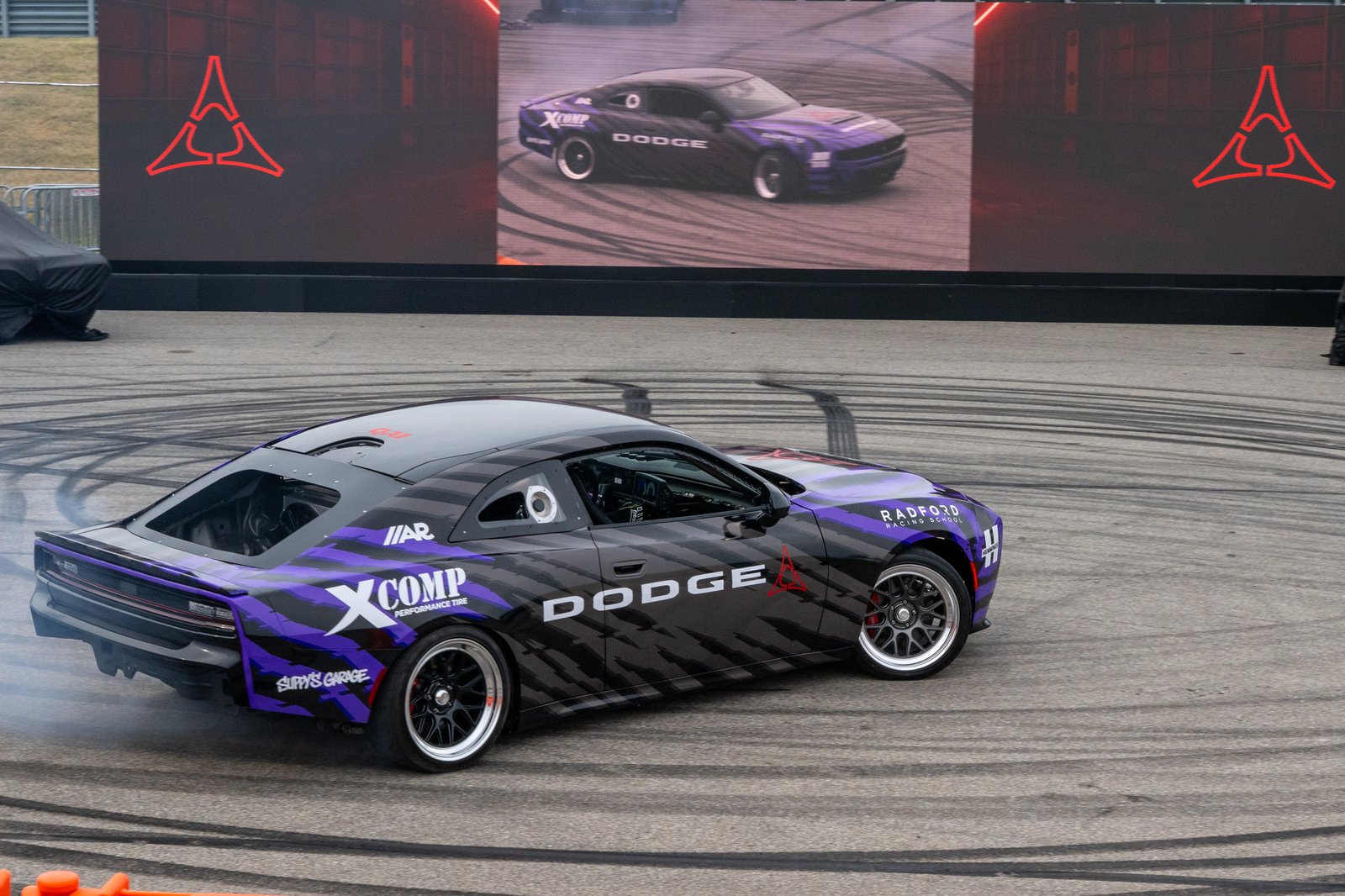 Rear three-quarter view of Dodge Charger drift car on track