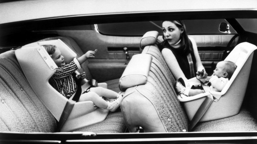 GM Love Seat child safety seats with toddler and infant in car