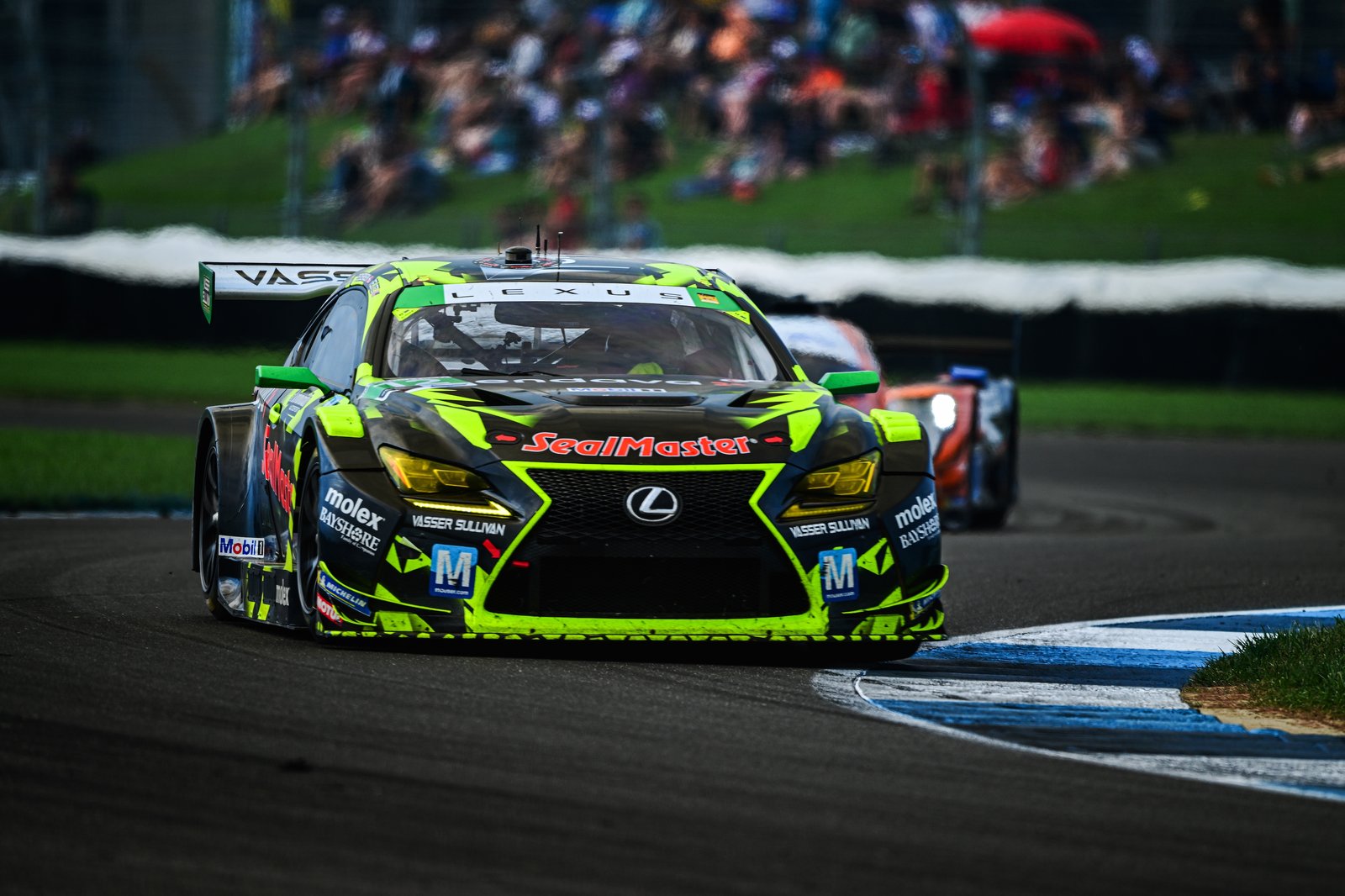 No. 12 Lexus RC F GT3 on track ahead of a prototype at Indianapolis