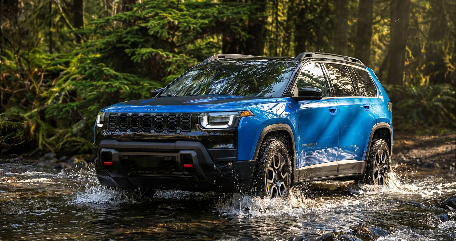 Blue 2027 Jeep Cherokee Trailhawk fording a forest stream, front three-quarter view