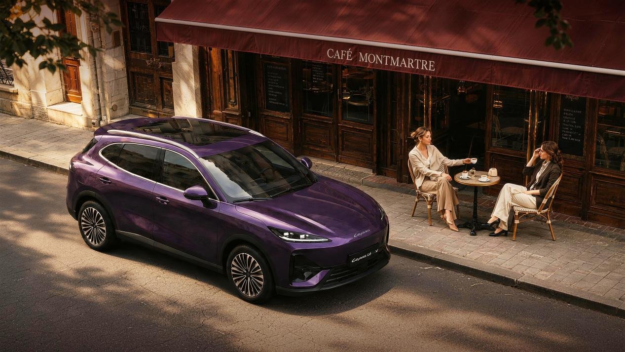 Purple Lepas L6 EV parked outside a Parisian-style cafe, viewed from above