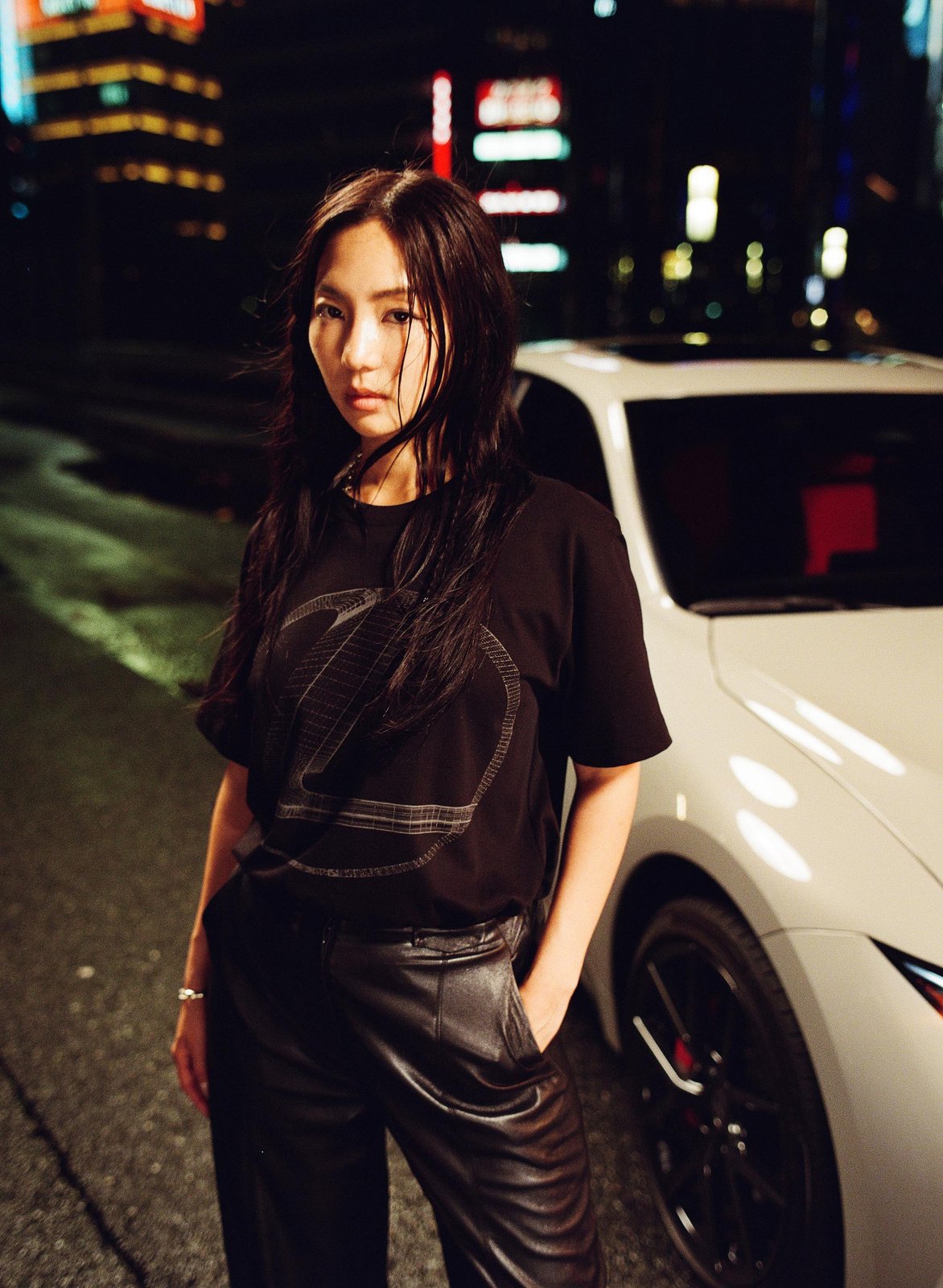 Drifter Sara Choi wearing black Lexus AMBUSH T-shirt beside white IS