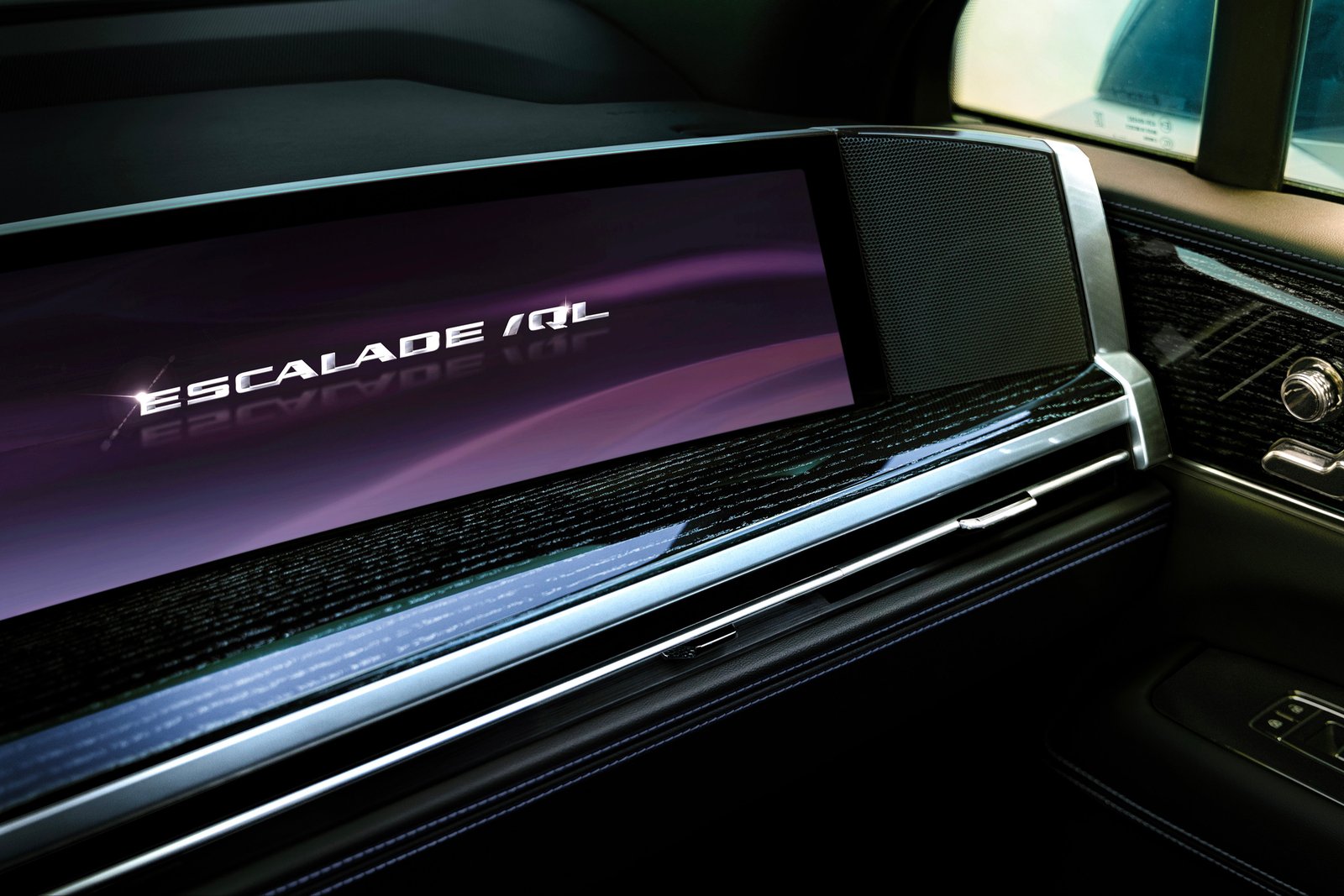 Escalade IQL logo on the dashboard display with wood trim
